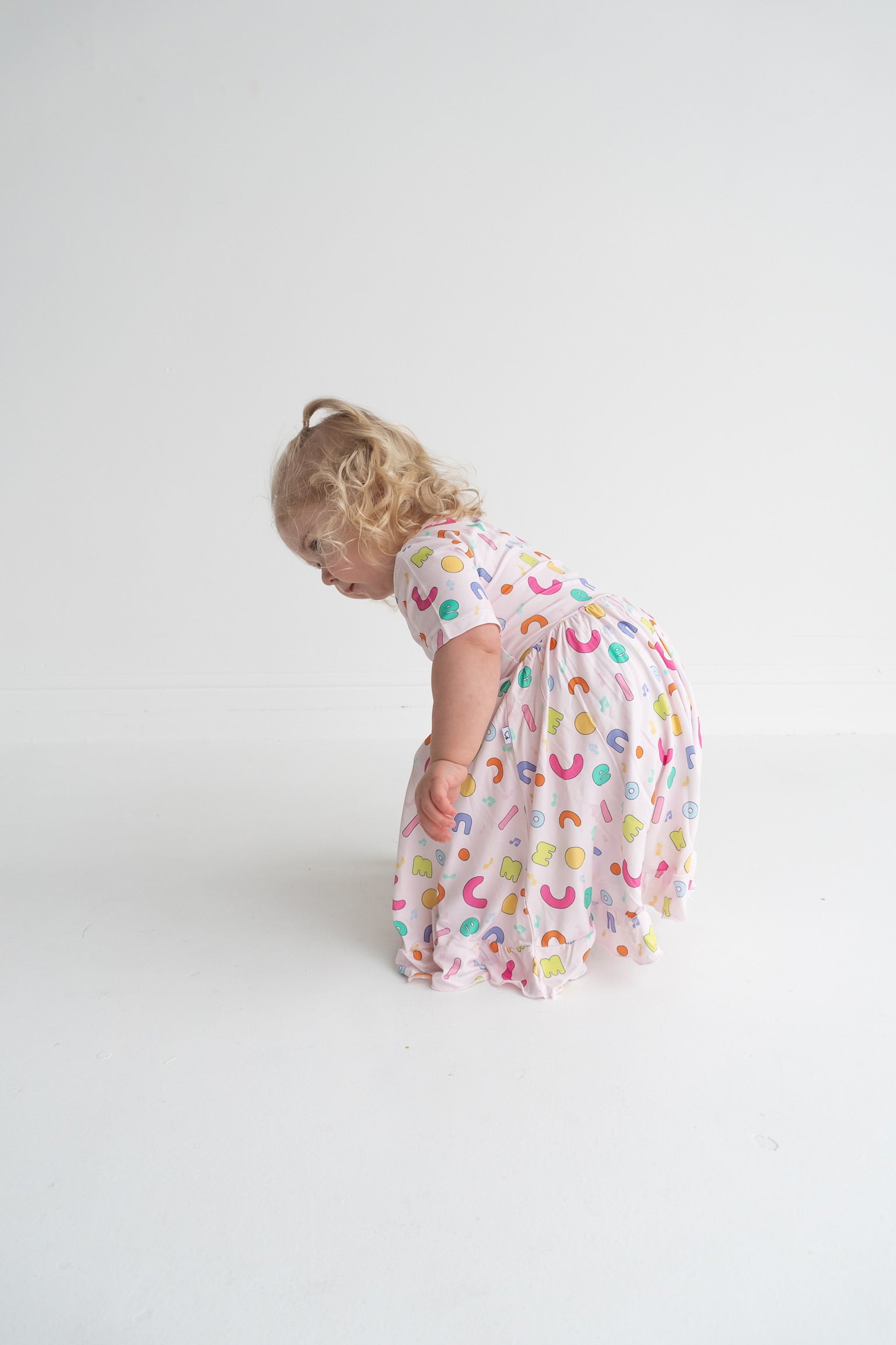 Dream Big Little Co x CoComelon ALPHABET SHORT SLEEVE DREAM RUFFLE DRESS