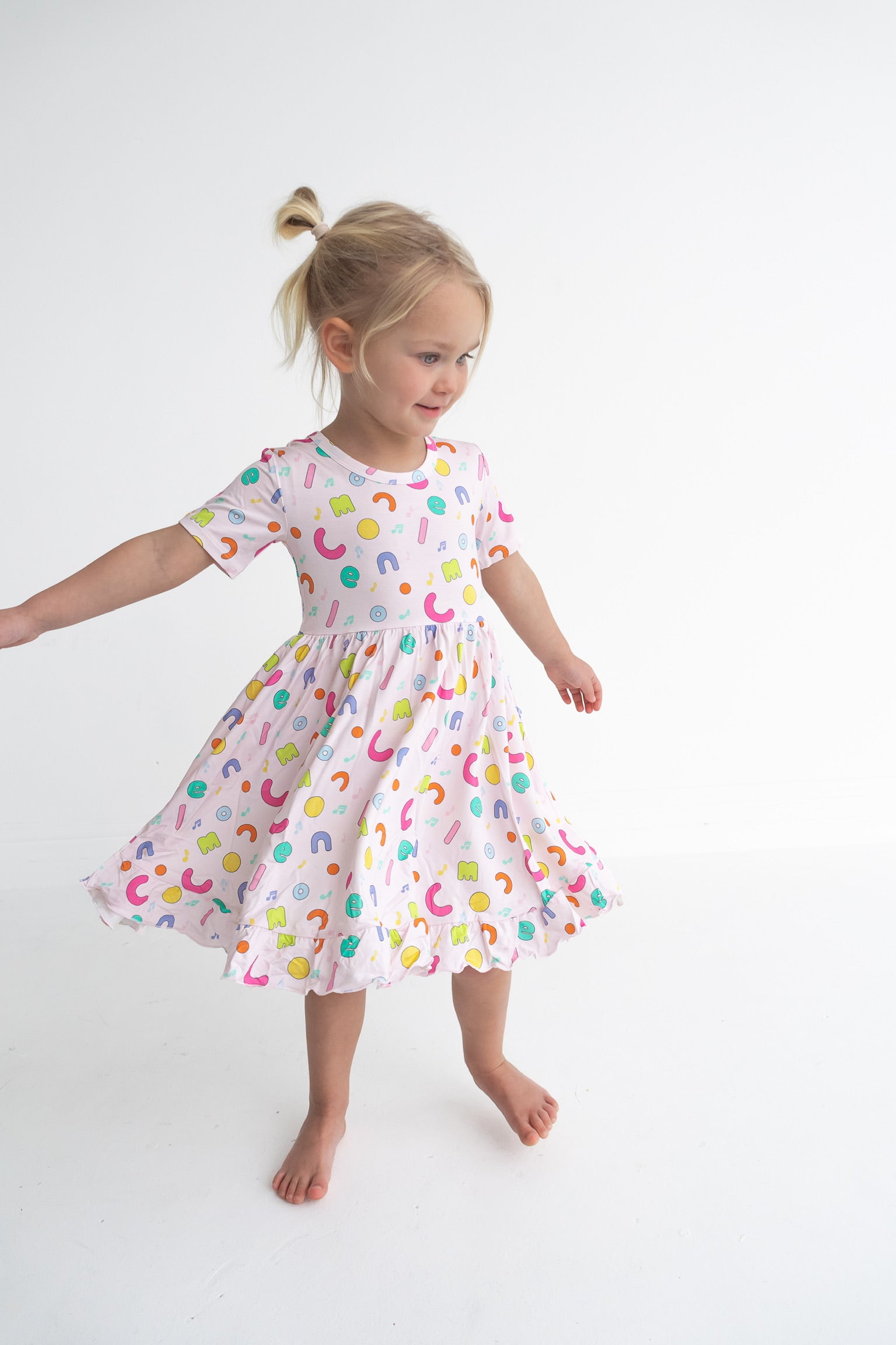 Dream Big Little Co x CoComelon ALPHABET SHORT SLEEVE DREAM RUFFLE DRESS