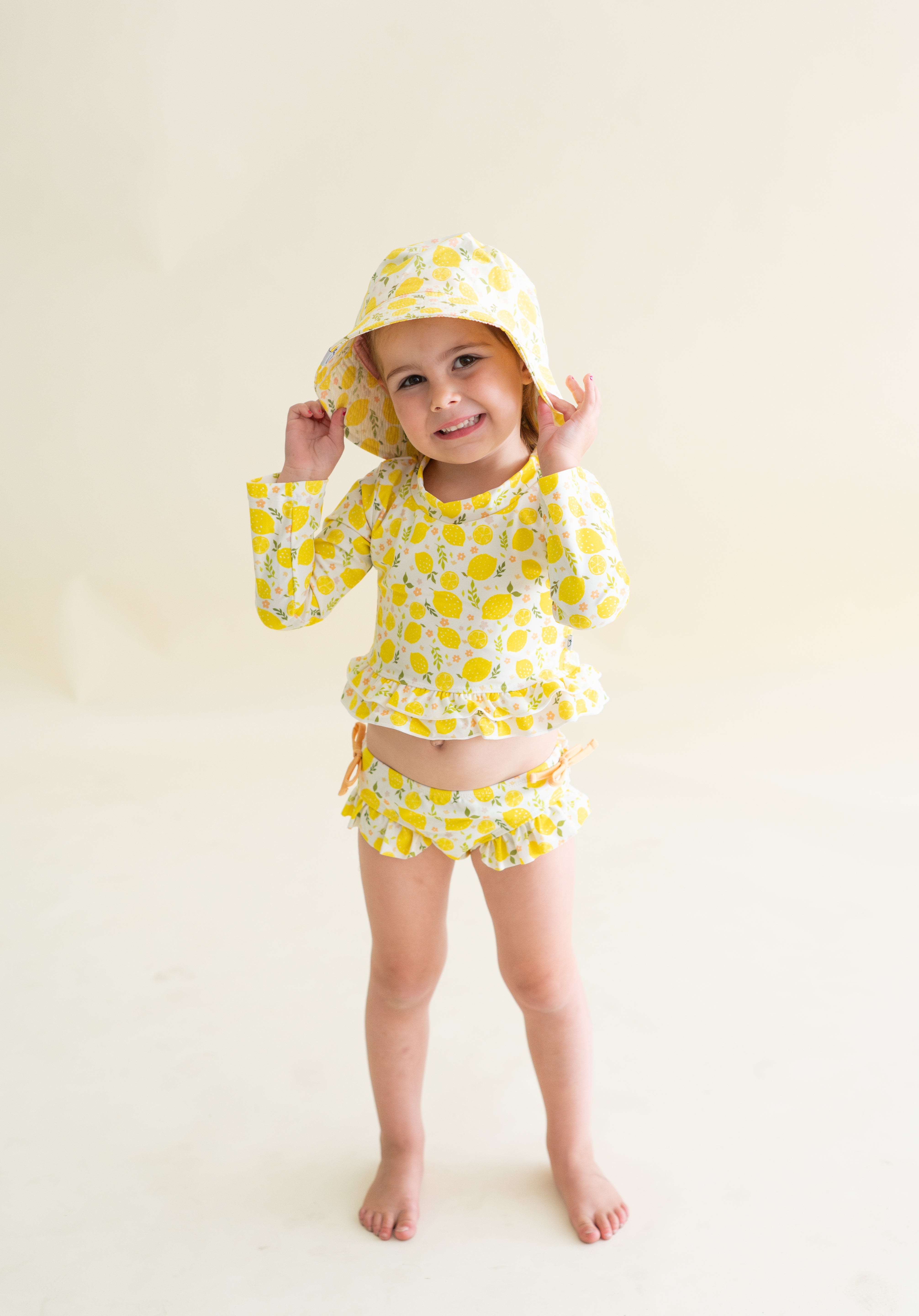 LEMON BLOSSOMS DREAM RASH GUARD RUFFLE TWO-PIECE SWIM SUIT