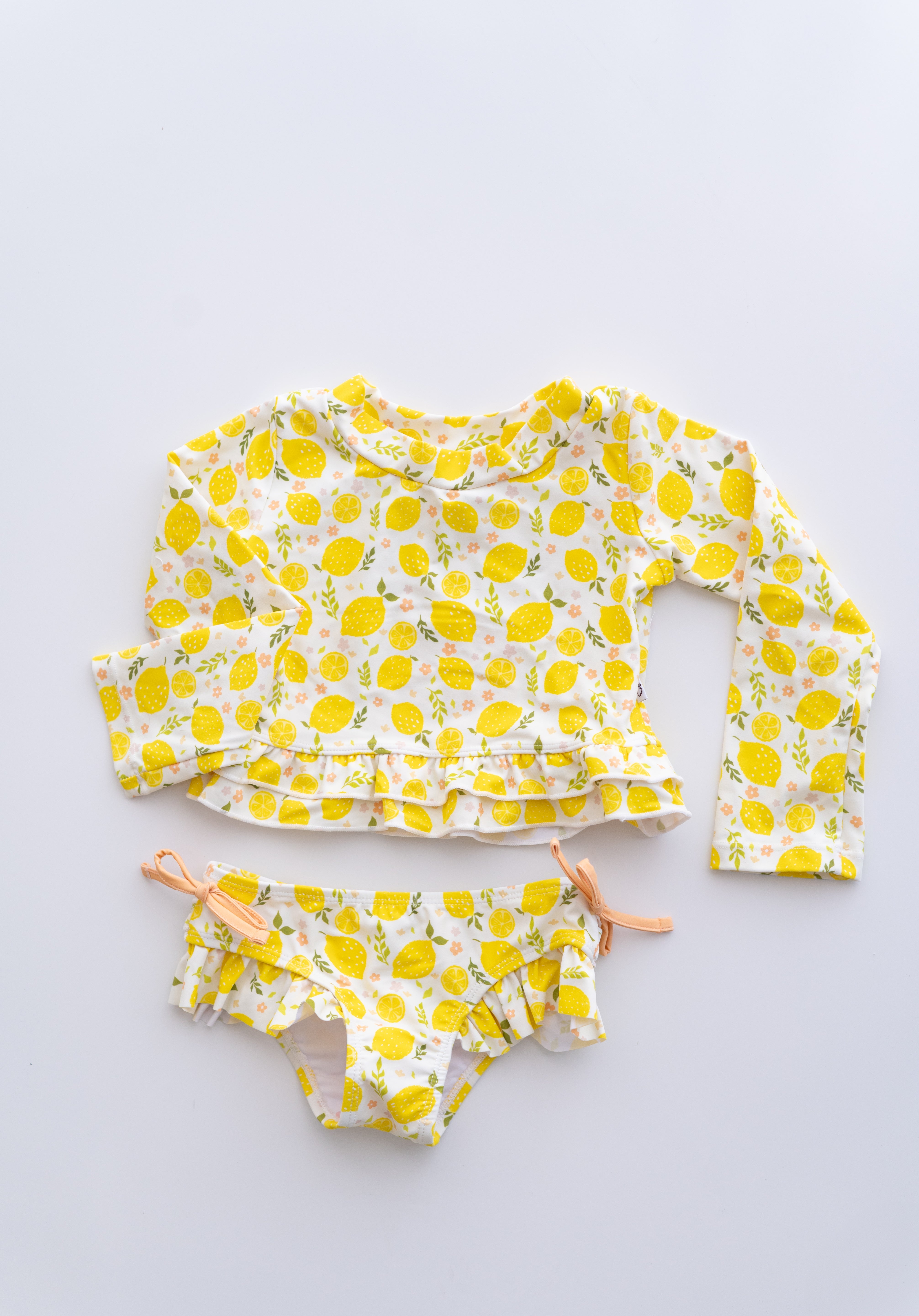 LEMON BLOSSOMS DREAM RASH GUARD RUFFLE TWO-PIECE SWIM SUIT