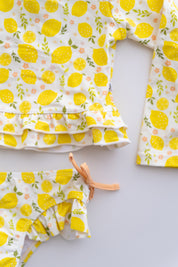 LEMON BLOSSOMS DREAM RASH GUARD RUFFLE TWO-PIECE SWIM SUIT