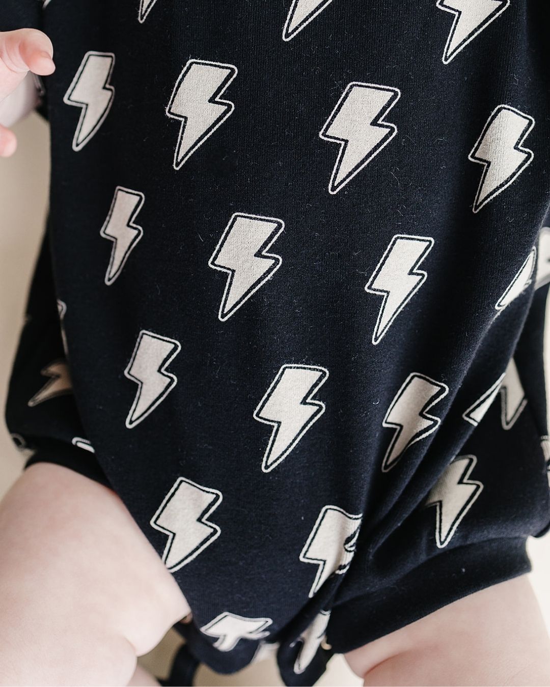 short-sleeve-bubble-romper-black-bolts-911457.jpg